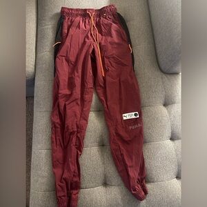 PUMA ’73 Burgundy Track Pants Black Side Panels Orange Drawstring Size Small